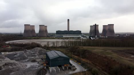 Aerial-dolly-view-across-coal-fired-power-station-site,-Fiddlers-Ferry-overcast-smokestack-skyline
