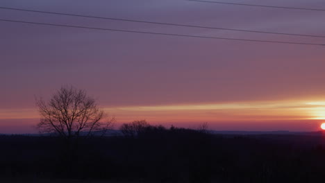 Medium-shot-of-an-electricity-pylon-at-sunrise