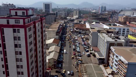 Aerial-Drone-Flight-over-Yaounde-City-Streets-in-Cameroon,-Africa