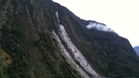 Landslide-destroyed-forest-on-majestic-cliff-at-Milford-Sound,-New-Zealand