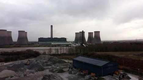 Aerial-rising-view-over-coal-fired-power-station-site,-Fiddlers-Ferry-overcast-smokestack-skyline