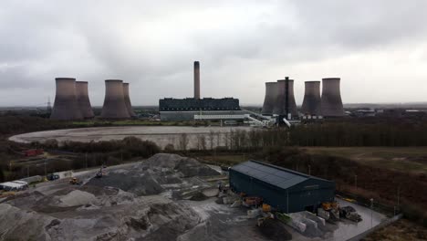 Aerial-view-dolly-across-coal-fired-power-station-site,-Fiddlers-Ferry-overcast-smokestack-skyline