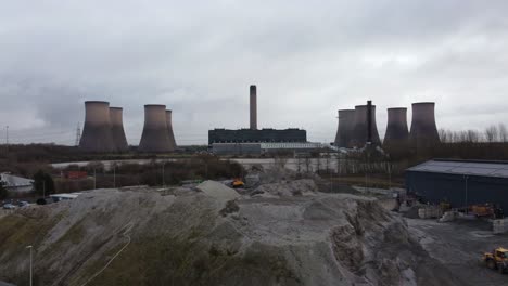 Industrial-coal-fired-power-station-site,-Aerial-view-across-Fiddlers-Ferry-smokestack-landmark-overcast-skyline
