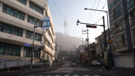 Wide-angle-static-shot-of-street-and-Namsan-Tower-in-Seoul-city,-Korea