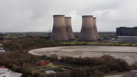 Aerial-view-slow-pan-across-coal-fired-power-station-smokestack-site,-Fiddlers-Ferry-overcast-skyline
