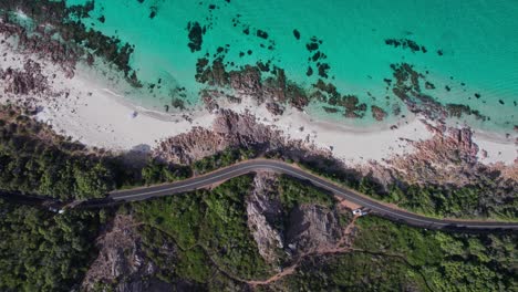 Aerial-topdown-anticlockwise-rotation-while-flying-up-of-the-coastline-road-and-ocean-in-Eagle-Bay-Western-Australia