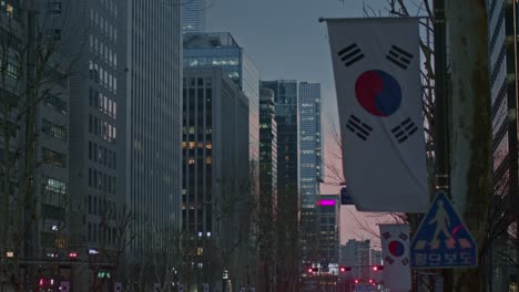 South-Korea-Seoul-Gangnam-night-city-town-urban-street-view-with-flags,-buildings,-constructions-and-skyscrapers-in-the-sunset