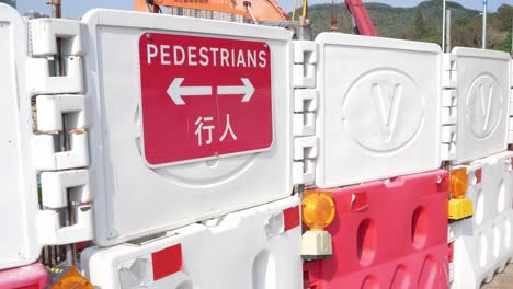 Red-Pedestrians-Signage-On-Barrier-At-Construction-Works-Site-At-Tseung-Kwan-O,-Hong-Kong