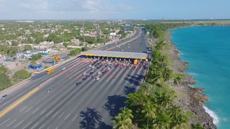 Toll-station-along-Las-Americas-expressway,-main-highway-along-Caribbean-shore-connecting-airport-and-Santo-Domingo