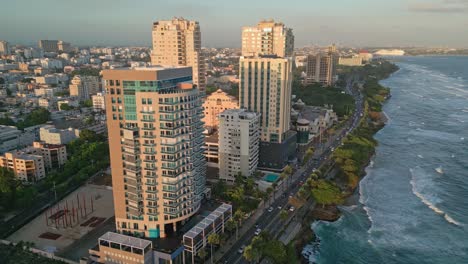 Cinematic-shot-with-drone-on-the-Malecon-of-Santo-Domingo-at-sunset