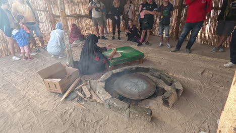 Women-showing-tourists-in-Egypt-how-to-make-flat-bread-or-aish-baladi