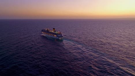 Aerial-view-of-PACIFIC-COAST-CRUISE-DEPARTING-FROM-PORT-OF-SANTO-DOMINGO-On-CARIBBEAN-SEA-during-golden-sunset