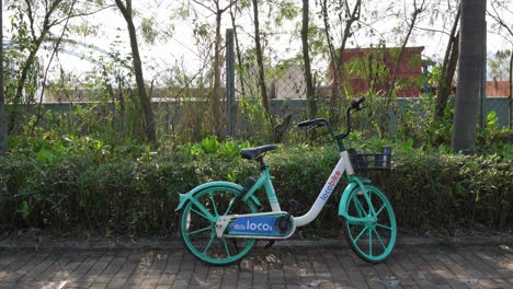 13-February-2023---Parked-Lone-Loco-Rental-Hire-Bike-On-Pavement-In-Tseung-Kwan-O-In-Hong-Kong
