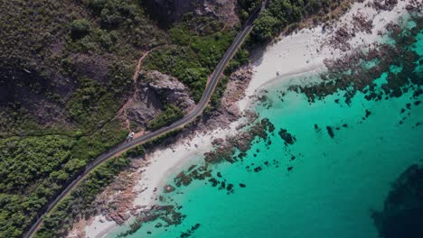 Aerial-flying-down-towards-the-road-and-coastline-in-Eagle-bay,-dunsborough,-Western-Australia