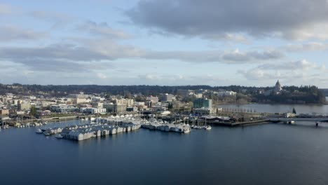 Drone-of-PNW-capital-city-downtown-with-sail-boats-in-marina