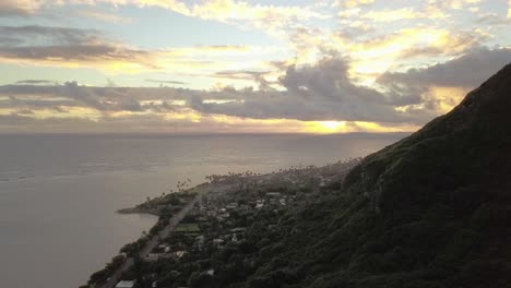 the-city-of-Kaaawa-Hawaii-aerial-from-crouching-lion-hiking-trail-at-sunset---AERIAL-DOLLY