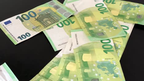 green-100-euros-drop-on-table