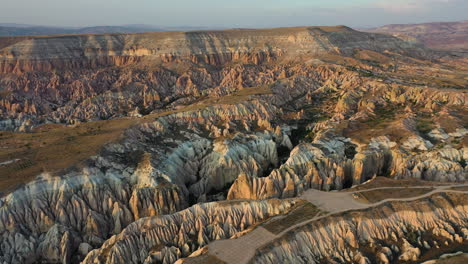 Wide-cinematic-drone-shot-of-the-landscape-in-Cappadocia,-Turkey