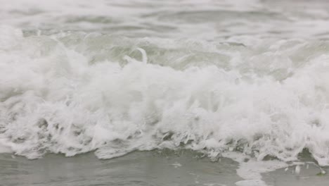 Foamy-Waves-Splashing-On-The-Seacoast.-Close-Up