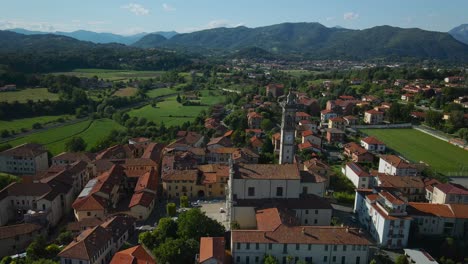 Aerial-View-Of-Chiesa-Parrocchiale-di-San-Carlo-a-Pagnano-In-Idyllic-Village-Town-In-The-Countryside-In-Italy