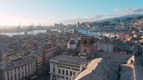 Aerial-over-historic-old-city-of-Genoa,-Italy---skyline-view-of-Porto-Antico
