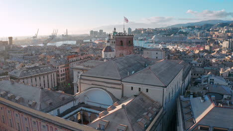 Aerial-riser-view-over-buildings-toward-Porto-Antico---historical-Genoa,-Italy