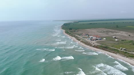 Panoramic-View-Over-Beach-In-The-Scenic-Town-Of-Vama-Veche-In-Romania---aerial-drone-shot