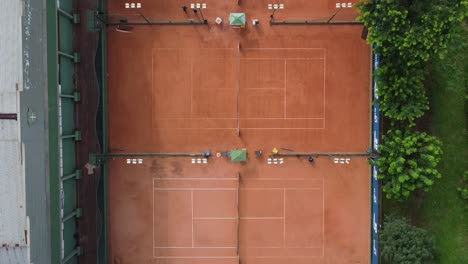 Bird`s-Eye-shot-of-3-clay-tennis-courts