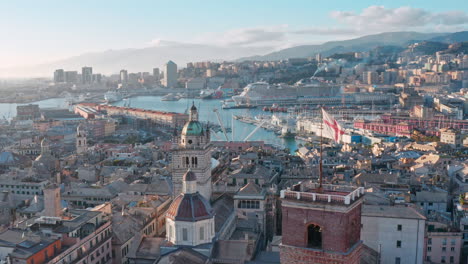 Genoa-rooftops-drone-flight-past-Grimaldina-and-Genoa-Cathedral-towers,-Italy
