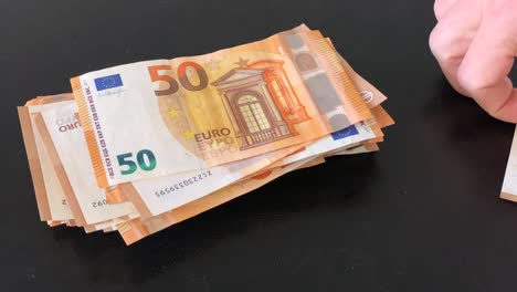 sorting-and-stacking-a-lot-of-50-euro-banknotes