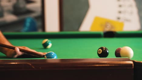 Billiard-player-triyng-to-trick-jump-shot-and-miss