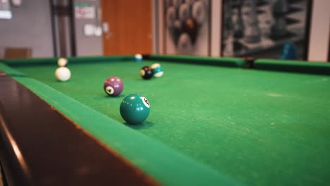 Billiard-table-trick-shot-jumping-over-and-sinking-the-ball-in-the-pocket