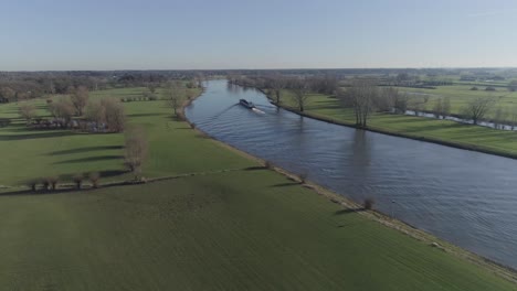 Drone-shot-of-freighter-boat-on-a-river