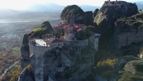 4K-Meteora-Monestary-of-Varlaam-Rise-to-BIRDS-EYE-VIEW---The-Great-Meteoron-in-the-distance,-Monestary-on-a-Mountain,-Landscape---Aerial-Drone,-Μετέωρα,-Ελληνικά,-Ancient-Greece,-Cinematic,-God
