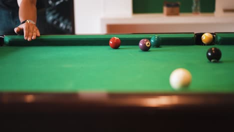 Sinking-nine-ball-on-billiard-table-with-a-nice-shot-rebound-with-white-cue-ball