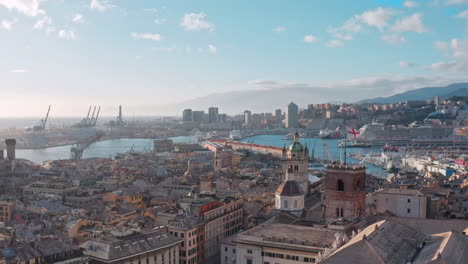 Aerial-riser-in-heart-of-Genoa,-view-over-historic-buildings-toward-Porto-Antico