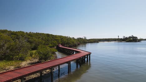 Timber-boardwalk-winding-along-a-protected-mangrove-ecosystem-and-conservation-wetland