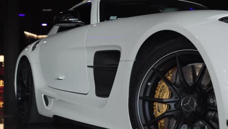 Close-up-of-a-beautiful-white-sports-Mercedes-in-a-car-dealership