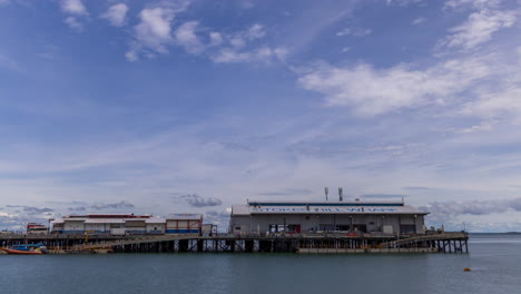 Timelapse-of-clouds-moving-over-Stokes-Hill-Wharf,-during-the-afternoon-on-Darwin-waterfront