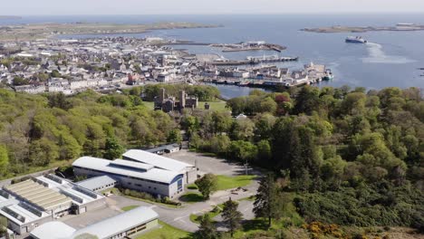 Drone-shot-of-Stornoway-with-a-passenger-ferry-leaving-port-in-the-background
