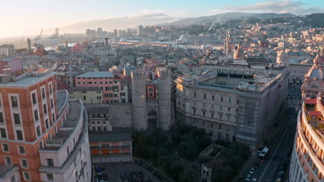 Aerial-at-sunset-toward-historic-Walls-of-Barbarossa-,-Genoa