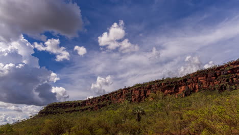 Timelapse-of-clouds-moving-across-mountain-tops-in-the-Northern-Territory,-mid-afternoon
