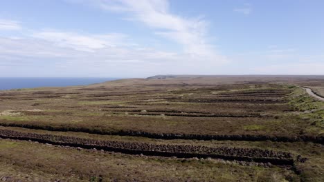 Drone-shot-of-a-tractor-full-of-peat