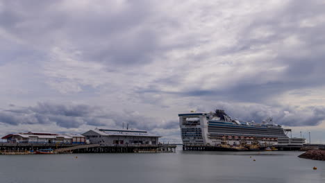 Timelapse-of-clouds-over-Stokes-Hill-Wharf,-with-cruise-ship-berthed-at-Darwin-waterfront