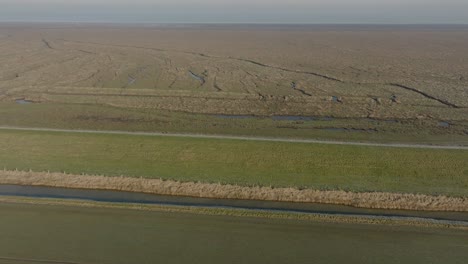 Salt-Marsh-Sea-Defence-Dike-The-Wash-Norfolk-UK-Aerial-Landscape-Frosty-Misty-Morning-Winter-Coastline