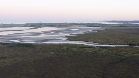 Wide-drone-shot-of-the-estuary-near-Stornoway-at-Golden-Hour