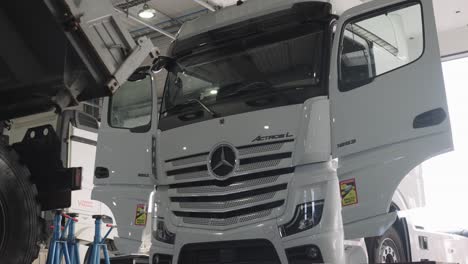 White-Mercedes-truck-being-repaired-at-the-heavy-duty-garage