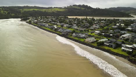 Brown-ocean-water-after-Cyclone-Gabrielle-passes-through-Cooks-Beach-along-the-Coromandel-Peninsula-of-New-Zealand-on-February-14