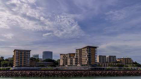 Timelapse-of-moving-clouds-over-the-Darwin-city-skyline-from-the-waterfront,-during-mid-afternoon