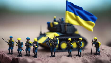 Ukrainische-Miniaturspielzeug-Armeesoldaten,-Kampfpanzer-Und-Ukrainische-Flagge-In-Kriegsszenenillustration,-Makro-Tilt-Shift-Konzept